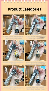 Detail showing six styles of black and gold astronaut liquid quicksand keychains