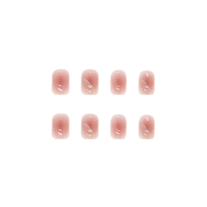 Translucent nude pink squoval press-on nails with marble texture in a 8-piece set