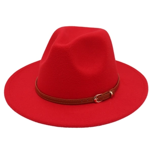 Detail of red wool fedora hat featuring a brown leather belt with a gold metal buckle