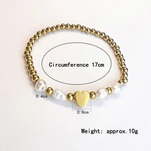 Elastic stainless steel bead bracelet with baroque pearls and gold heart charm