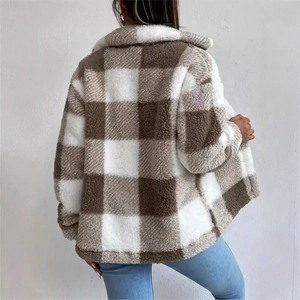 Detail of elegant brown and white plaid plush jacket showing soft wool-like texture on back