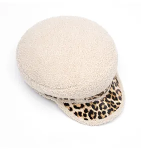 Detailed top view of beige faux shearling military cap with leopard print brim texture