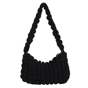 Minimalist black popcorn textured hobo shoulder bag with pleated fabric and zipper