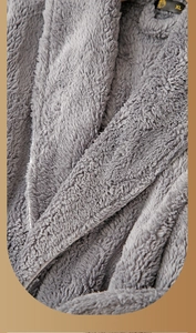 Detail view of thickened gray plush fleece bathrobe showing soft texture and XL size label