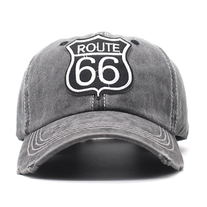 Front view of dark grey washed cotton baseball cap with ROUTE 66 embroidery and distressed brim