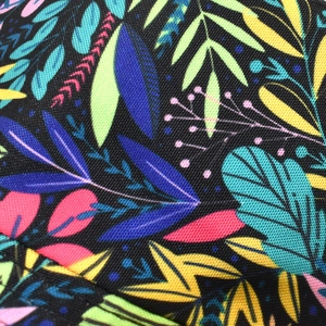Detailed macro view of tropical leaf print on durable twill fabric bucket hat material