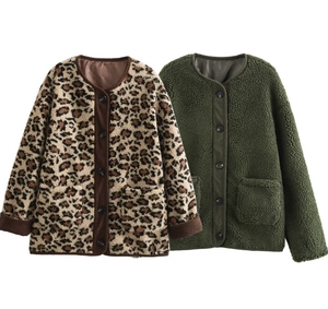 Detail view of leopard print and dark green faux shearling jackets with button pockets