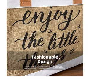 Close-up of natural jute tote bag texture with 'enjoy the little things' print