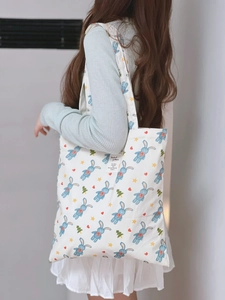 Minimalist white cotton canvas tote bag with cute rabbit illustration and sturdy shoulder straps