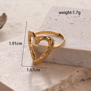 Adjustable golden heart ring with hammered oil painting texture on beige stone