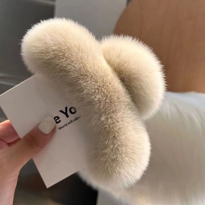 Large plush faux rabbit fur claw clip in beige, soft winter hair accessory for women