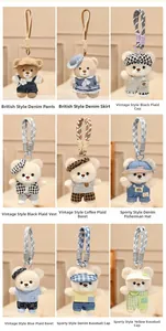 Detail showing nine styles of teddy bear plush keychains with various cute outfits