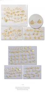 Detail view of gold stud earrings featuring heart, crown, and zircon star motifs
