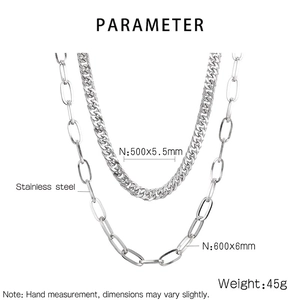 Macro detail of stainless steel curb and paperclip chain set showing sizes and textures