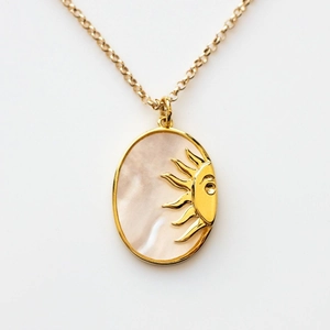 Golden stainless steel oval pendant necklace with mother of pearl and sun motif design
