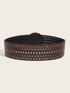 Detail of dark brown wide PU leather belt with multiple metal eyelets and bronze buckle