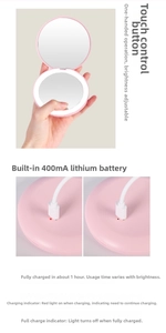 Pink LED travel mirror detail showing charging port, battery status and touch control