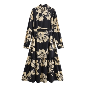Elegant black long-sleeve floral maxi dress with waist tie and back-view ruffle hem