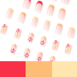 French tip press-on nails with red and orange floral designs and vibrant gradients
