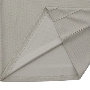 Detail of light gray waffle knit fabric texture and double-stitch sewing on the garment hem