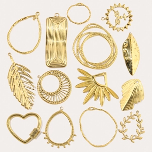 Golden geometric pendants including heart and leaf shapes for DIY jewelry making
