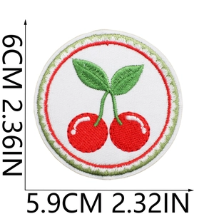 Detail view of cherry embroidery patch with size dimensions 5.9cm x 6cm on white background