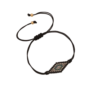 Bohemian hand-woven cord bracelet with multi-color beads and adjustable gold bead ends