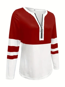 Detail of red and white striped sweatshirt with V-neck and metal ring zipper closure