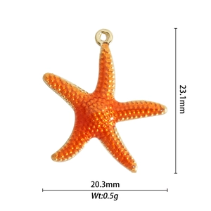 Macro shot of orange starfish charm showing 23.1mm by 20.3mm size and 0.5g weight detail