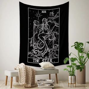 Detail of The Star tarot tapestry featuring black and white bohemian mystical patterns