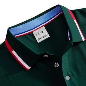 Close-up of dark green moisture-wicking Polo shirt featuring striped collar and size M label