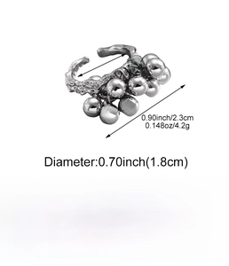 Detail view of irregular textured silver ring with polished spherical beads and 1.8cm diameter