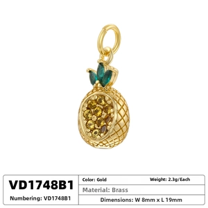 Detailed close-up of gold pineapple pendant with yellow and green crystals, 8mm x 19mm