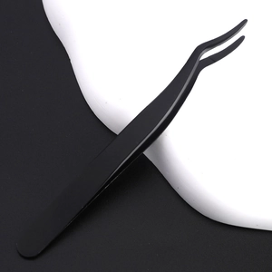 Close-up of black curved stainless steel eyelash tweezers with professional matte finish