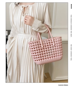 Close-up of pink hollow woven jelly bag featuring intricate basket weave texture