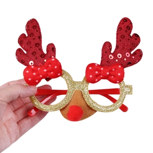 Detail of Christmas reindeer glasses with red sequin antlers and gold glitter frame