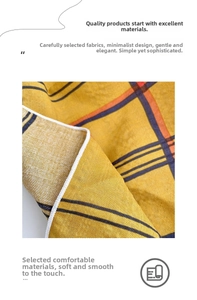 Macro texture of soft ginger plaid linen fabric showing detailed woven patterns