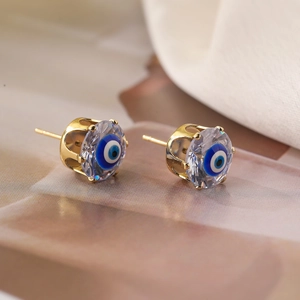 Gold plated evil eye stud earrings with blue zirconia and crown prong setting