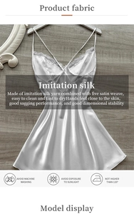 Detail of white imitation silk nightgown featuring delicate lace trim and satin texture