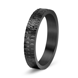 Detail of matte black dragon scale ring showing textured surface and brushed inner finish