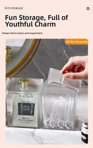 Macro view of clear acrylic storage box with vertical stripes and golden flower handle