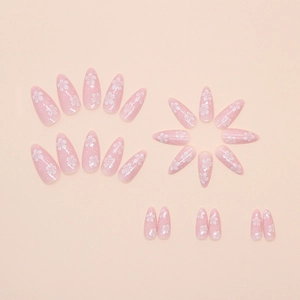 Pink cherry blossom press-on nails with white flower prints and glitter almond shape
