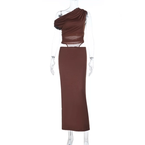 Close-up of brown off-shoulder maxi dress with mesh stitching and waist cut-out details