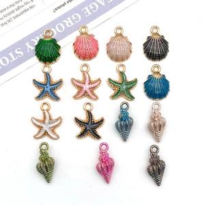 Close-up of 15 colorful enamel shell and starfish charms for DIY jewelry making