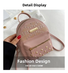Detailed close-up of pink mini backpack featuring gold studs and sparkling rhinestones