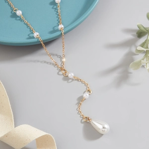 Elegant gold Y-shaped necklace with white pearls and large teardrop pendant detail