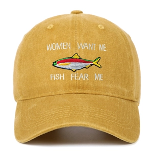 Close-up of Women Want Me Fish Fear Me embroidery on washed cotton mustard fishing hat