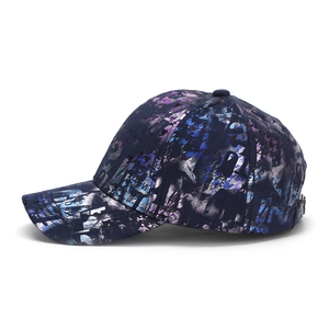 Detailed side view of the navy blue street-style graffiti baseball cap with abstract print