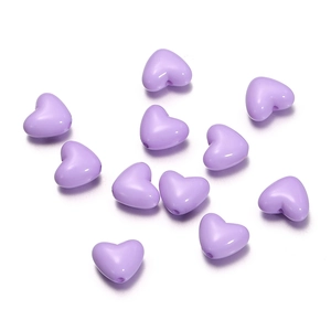 Macro shot of assorted light purple heart-shaped acrylic loose beads for DIY jewelry making