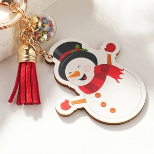 Cute Christmas snowman keychain with red tassel and star-filled glass ball charm